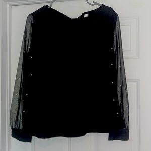 Black Blouse. Long mesh sleeves with pearl details.